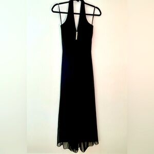 Vintage women’s Kiki black full length gown. Size small.